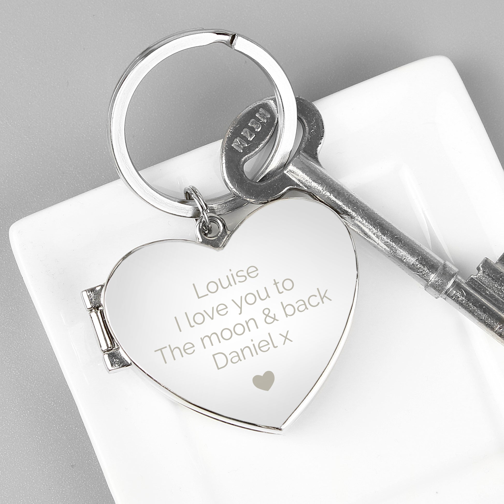 Heart-shaped keychain with your own personalised message above the heart motif.