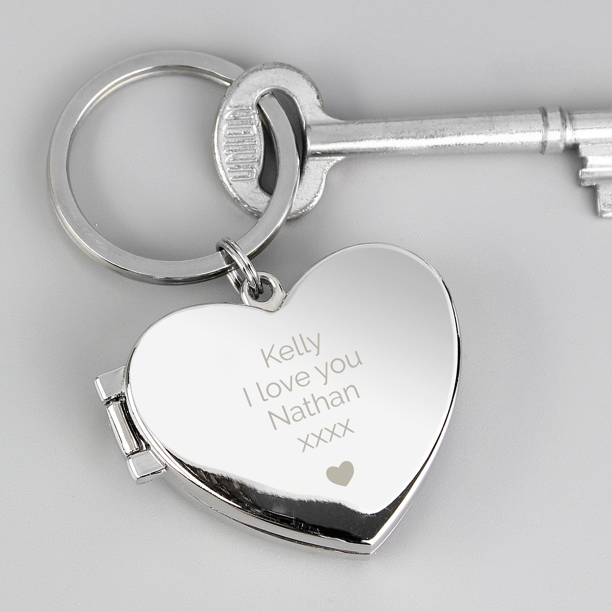 Heart-shaped keychain with your own personalised message above the heart motif.