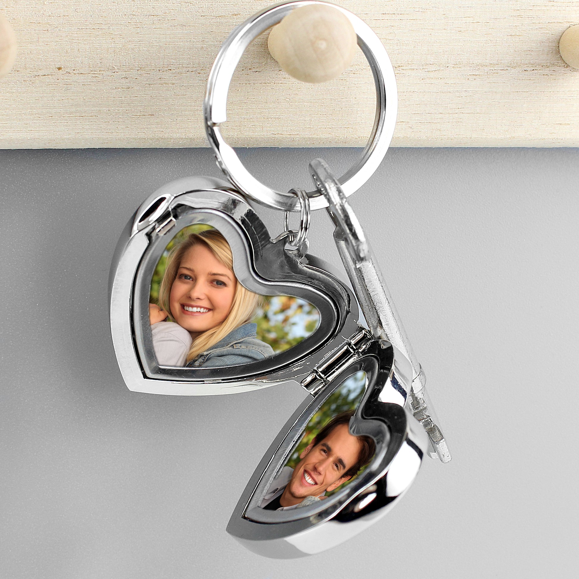 Interior of heart shaped locket showing two photos