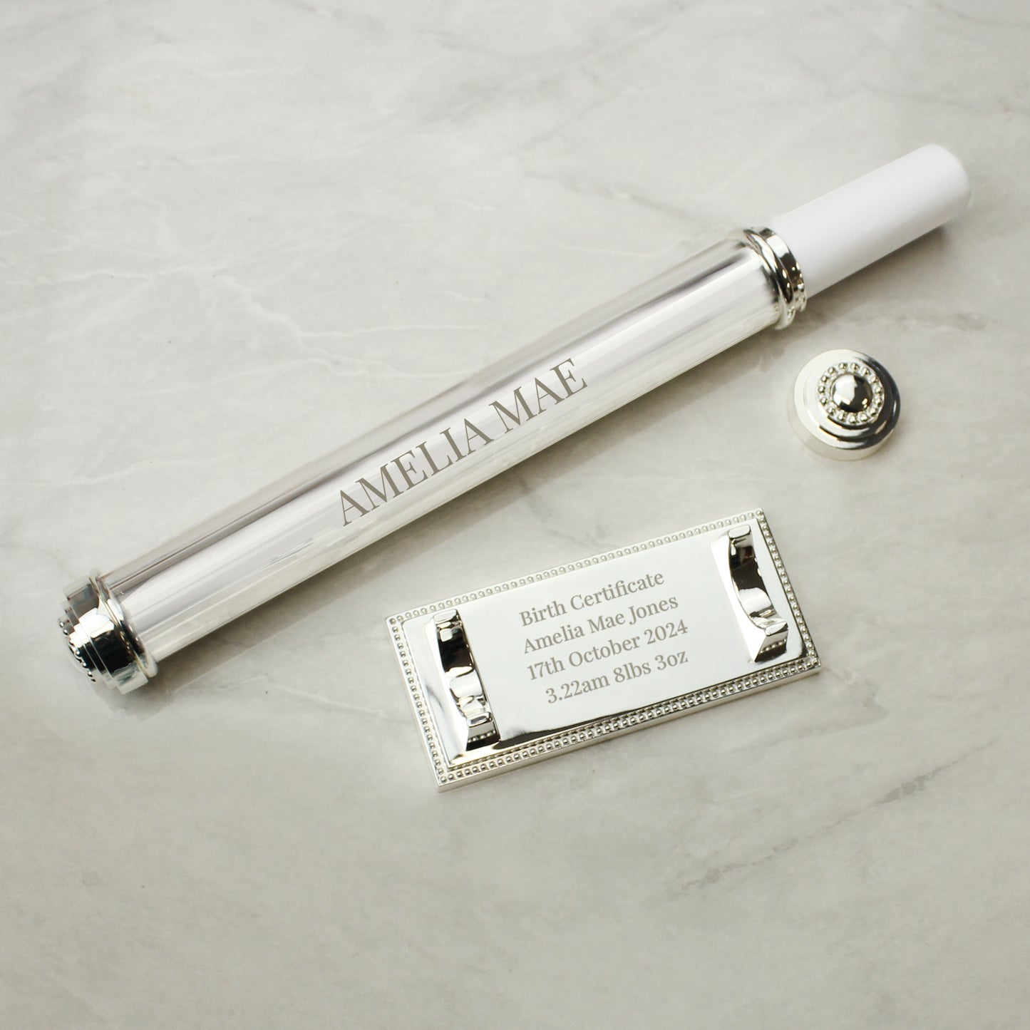 Silver plated certificate holder on a silver plated base shown as containing a birth cettificate for a baby and engraved with her name date of birth and birth weight 