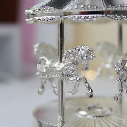 Pretty carousel music box, plays Rock-a-bye baby. Can be engraved with your own message. 