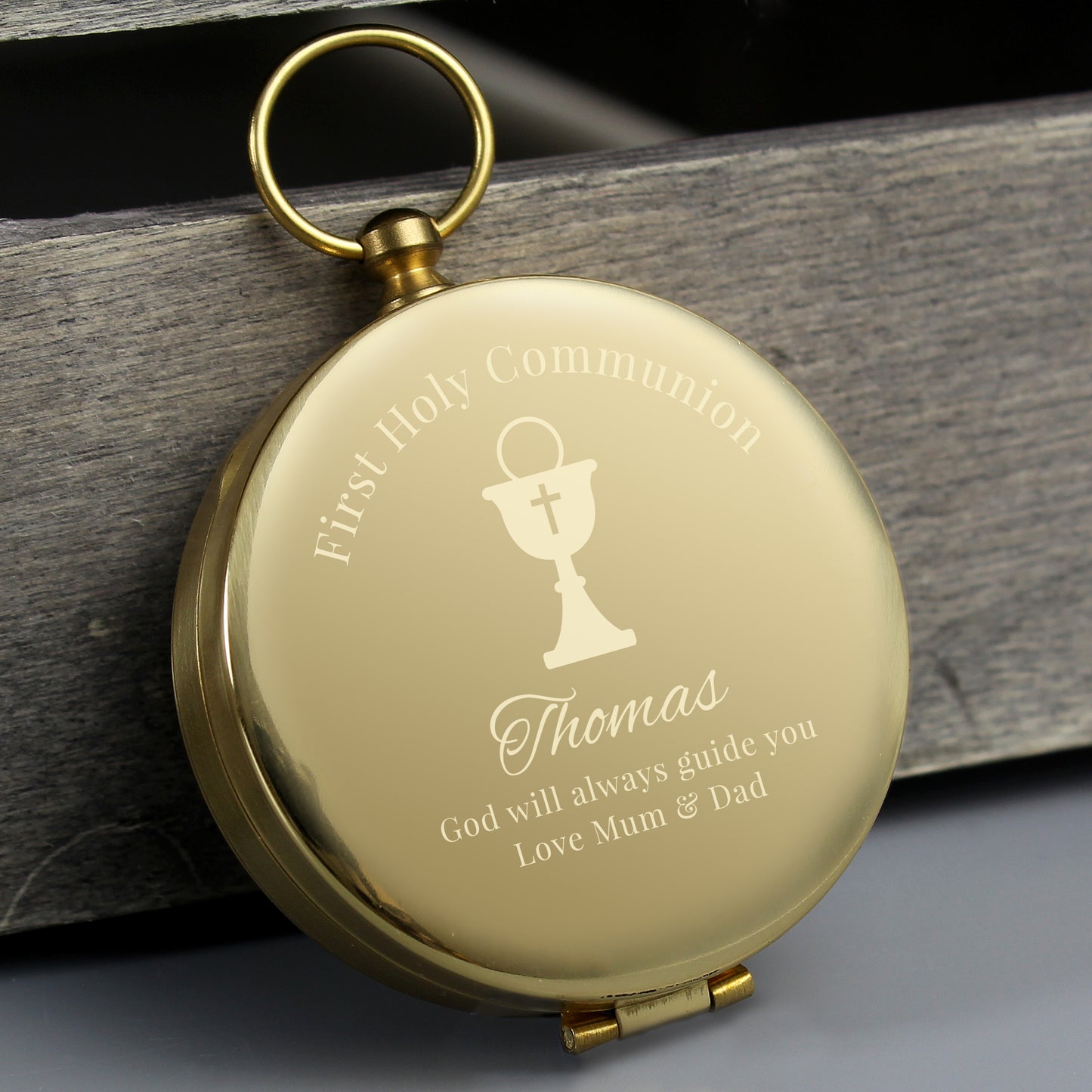Full compass in brushed metal effect case, engraved with First Holy Communion and an etched chalice with cross. can bepersonalised with a name and message of your choice