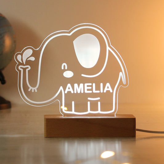 Childs LED light on wooden base. Cartoon elephant personalised with your child's name. Changing or fixed colour and brightness settings. Shown in white