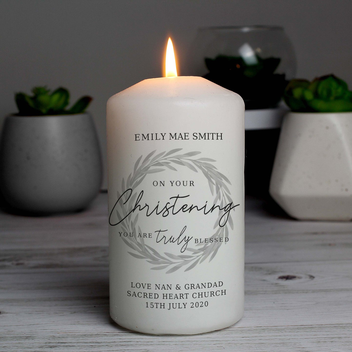 white christening candle which can be personalised with up to four lines of text, including the message "on your christening day you are truly blessed"