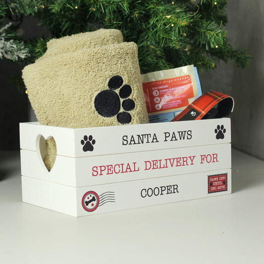 Small crate for pet at Christmas. Message reads Santa Paws special delivery for ... and you can add your pet's name. 