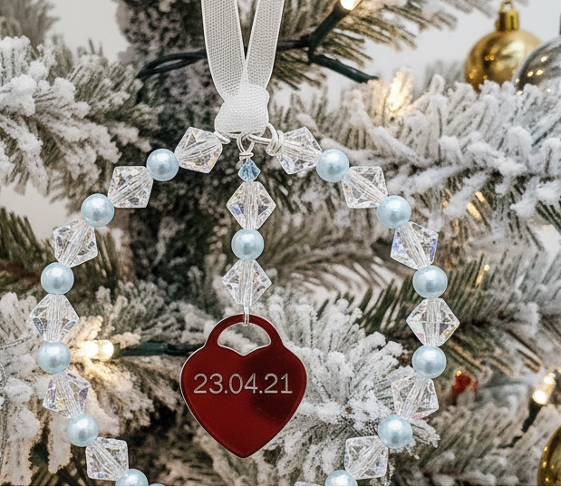 Crystal and pale blue Christmas tree decoration with enraved heart and tiny blue crystal.