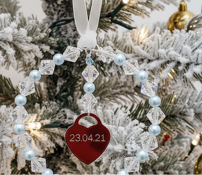 Crystal and pale blue Christmas tree decoration with enraved heart and tiny blue crystal.