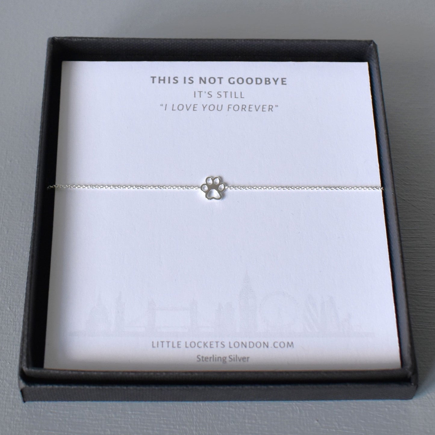 Sterling silver adjustable bracelet with paw print charm in gift box on message card "This is not goodbye, it's still I love you forever"