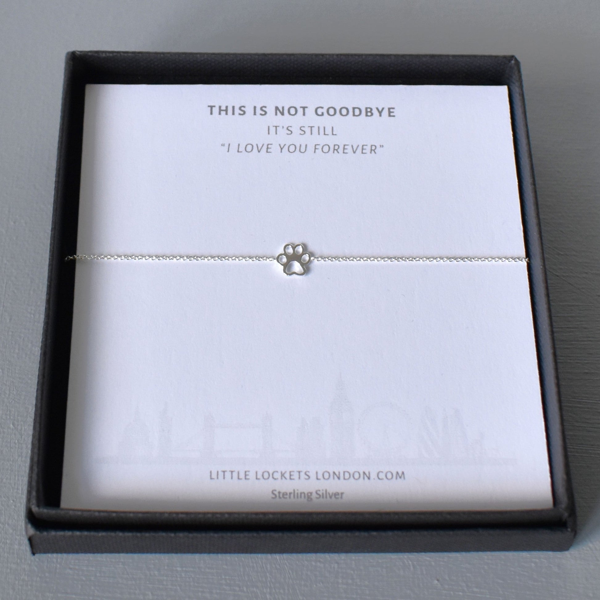 Sterling silver adjustable bracelet with paw print charm in gift box on message card "This is not goodbye, it's still I love you forever"