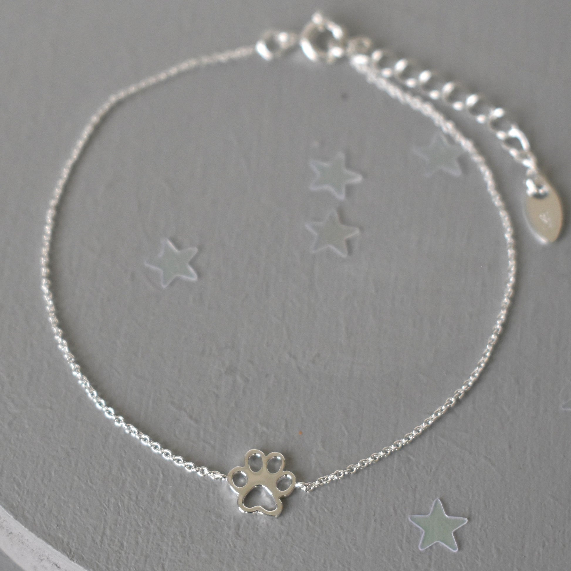 Sterling silver adjustable bracelet with paw print charm
