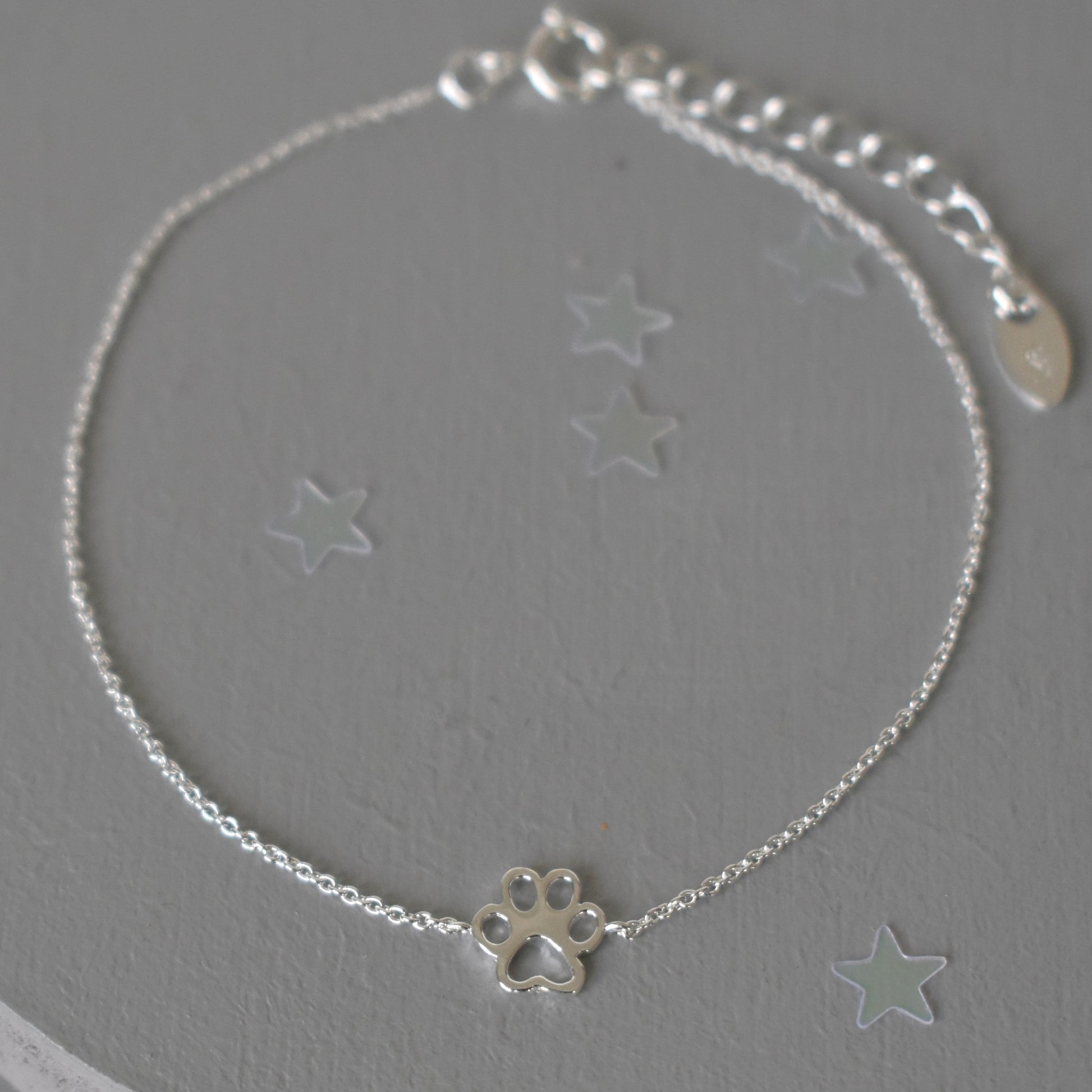 Sterling silver adjustable bracelet with paw print charm