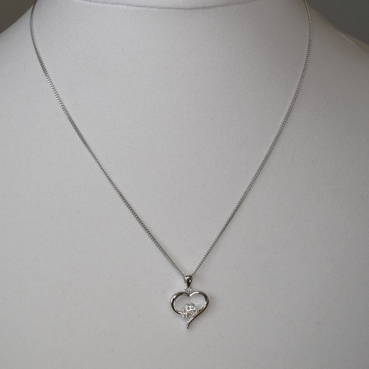 Silver heart shape necklace with crystal cubic zirconia paw print on 18" sterling silver diamond cut chain