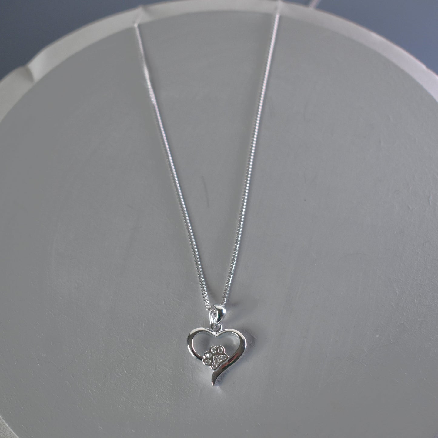 Silver heart shape necklace with crystal cubic zirconia paw print on 18" sterling silver diamond cut chain