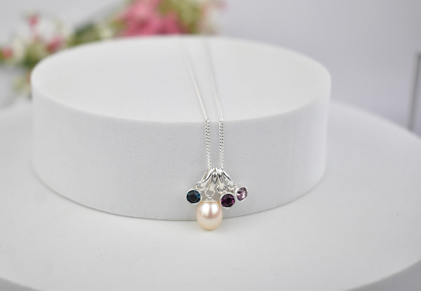 Freshwater pearl drop with three high quality birthstones suspended from an extendable 16-18" sterling silver chain
