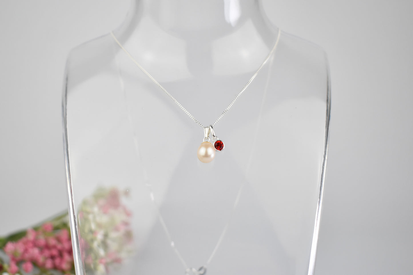 Freshwater pearl drop with one high quality crystal birthstone suspended from an extendable 16-18" sterling silver chain