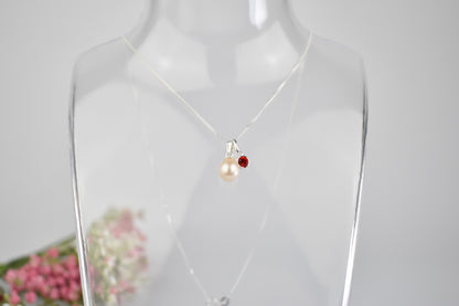 Freshwater pearl drop with one high quality crystal birthstone suspended from an extendable 16-18" sterling silver chain