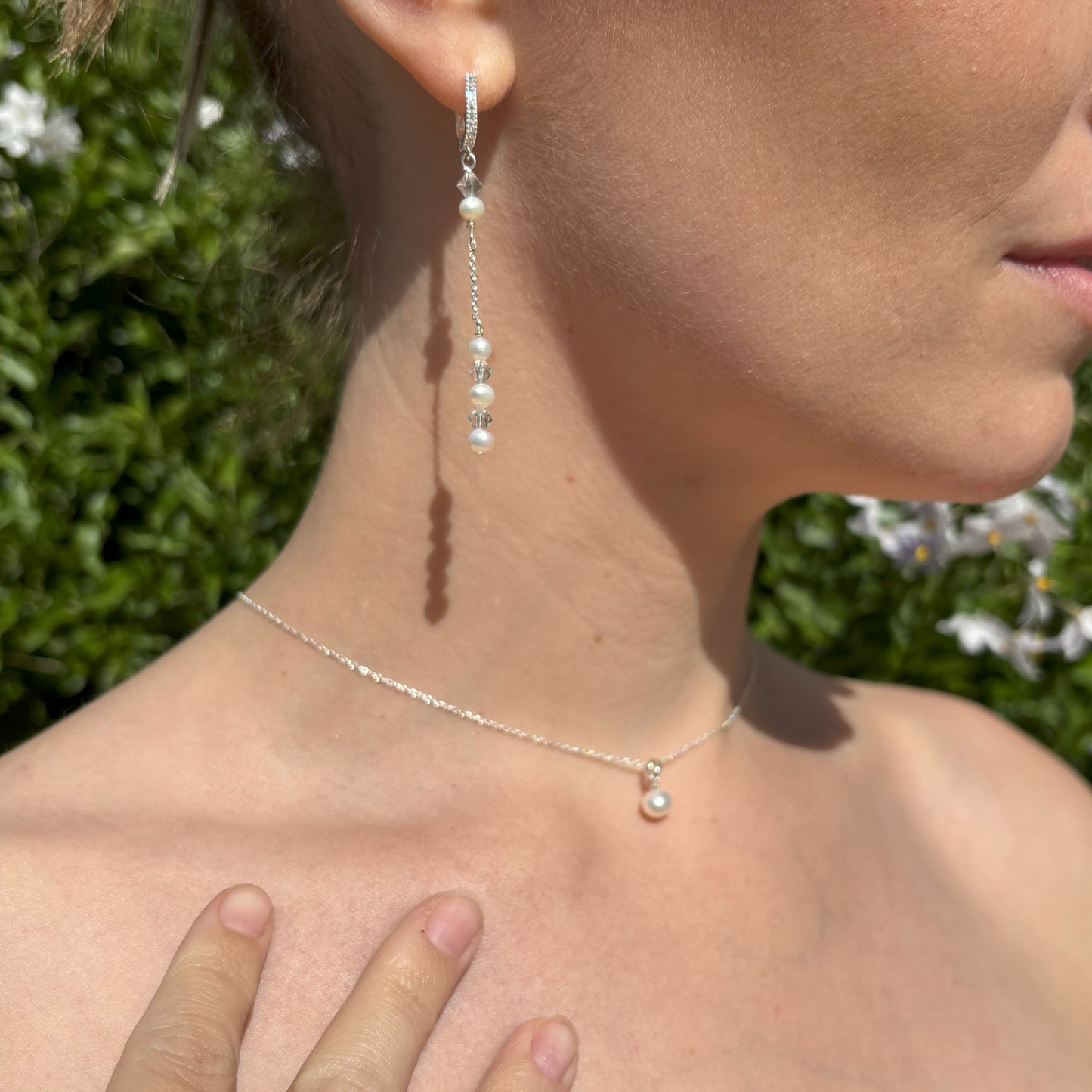 Front view of sterling silver pearl backdrop necklace