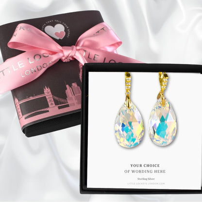 Crystal Pear drop earrings with gold plated sterling silver wires shown in gift box and a card with your choice of wording. Background shows optional upgraded gift wrap.