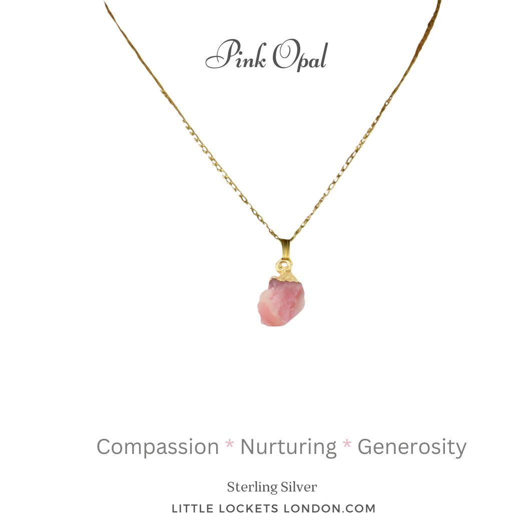 Pink opal raw crystal with sterling silver gold plated tip, suspended from a gold plated sterling silver chain. The opal is mounted on a card with the gem name and three of its qualities - compassion, nurturing and genorisity.