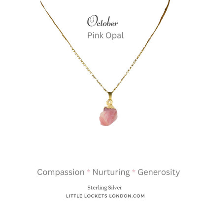 Pink opal raw crystal with sterling silver gold plated tip, suspended from a gold plated sterling silver chain. The opal is mounted on a card with the birthstone month of October and the gem name and three of its qualities - compassion, nurturing and genorisity.