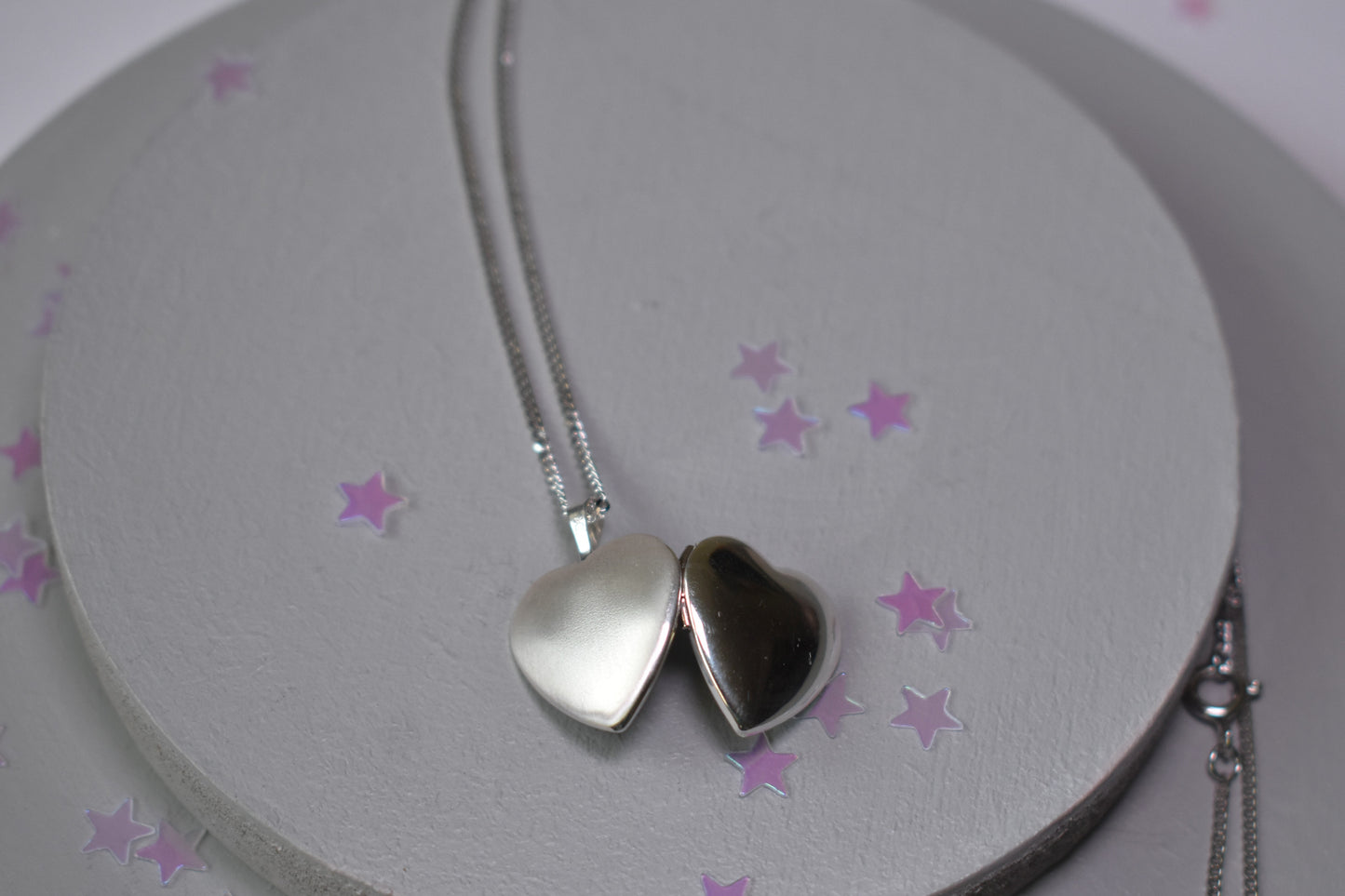 Heart shaped locket highly polished front and matt silver back