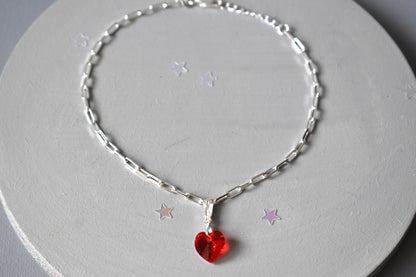 Sterling silver paperclip anklet with high quality crystal heart charm in your choice of colour. shown in red.