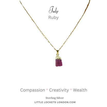 The ruby raw crystal pendant with gold plated sterling silver tip and suspended from a sterling silver gold plated chain. The pendant is mounted on card with the birthstone month of July, the  gem's name and three of its properties - compassion, creativity and wealth.