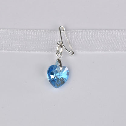 Blue crystal heart suspended from a sterling silver bail and a tiney sterling silver pin. Pin it in a secret place on your gown or add  it to your bouquet charm with the ribbon supplied.
