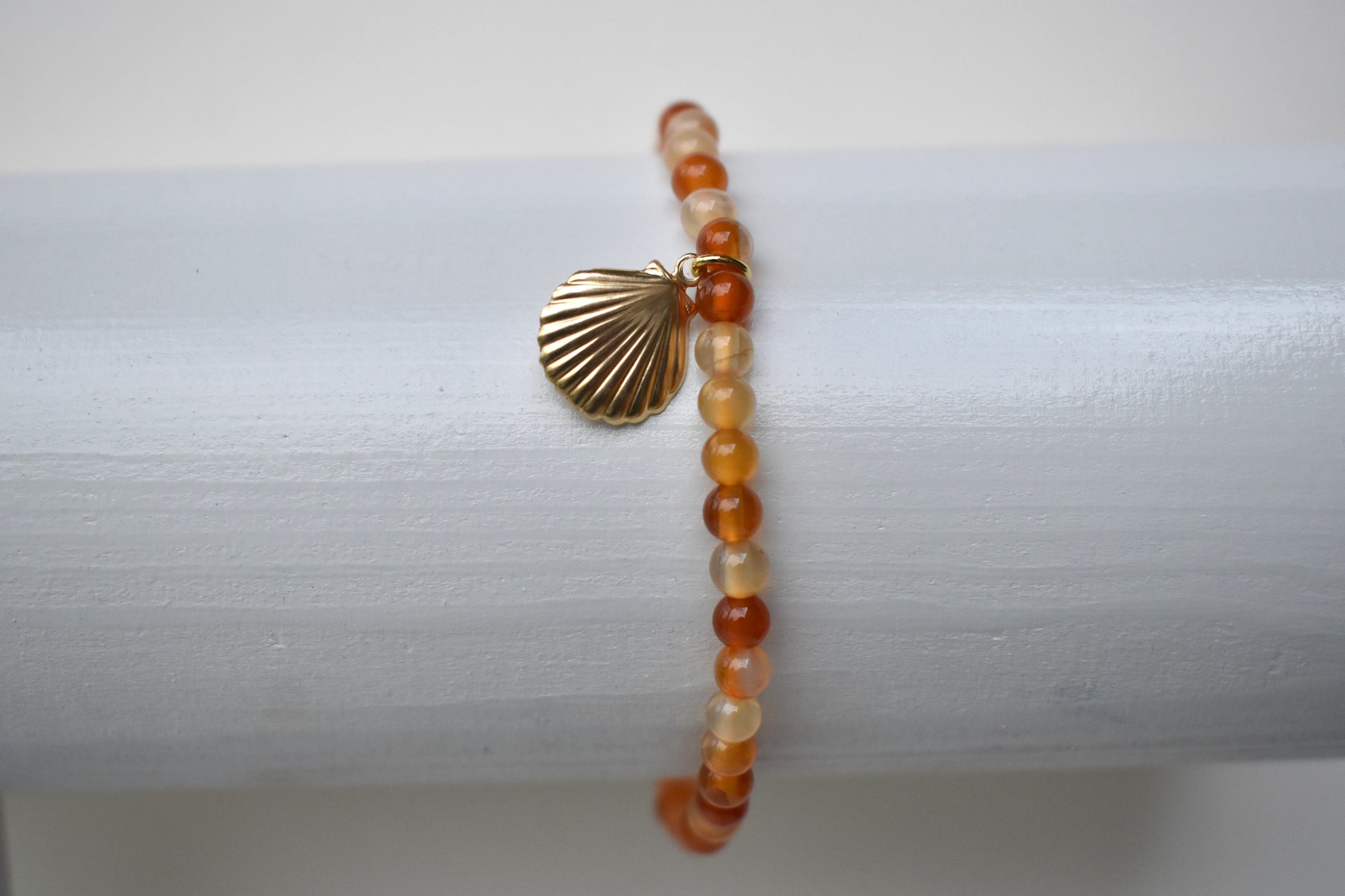 Carnelian elasticated bracelet with sterling silver gold plated shell