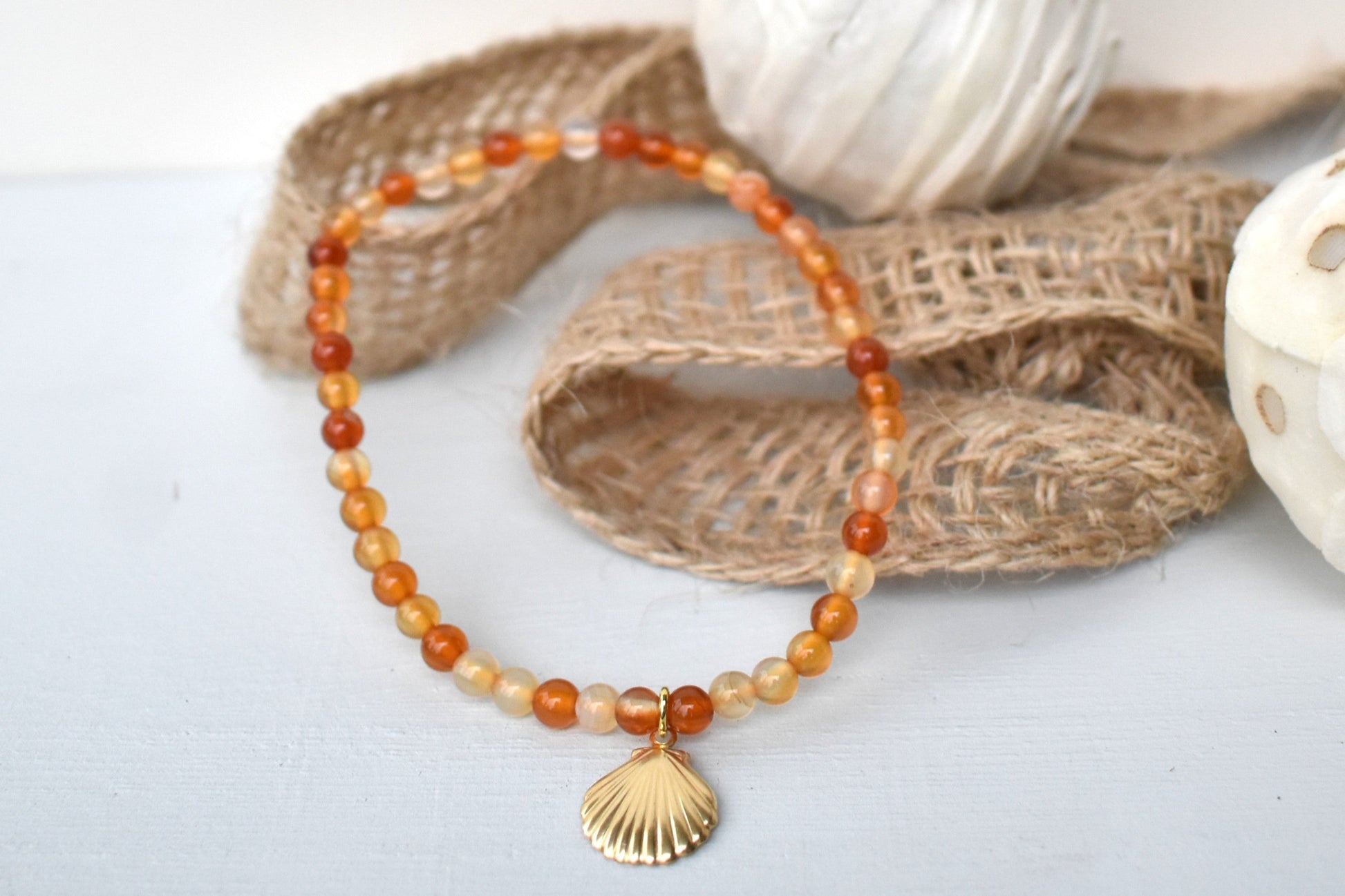 Carnelian elasticated bracelet with sterling silver gold plated shell