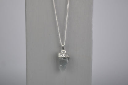 raw crystal moonstone shown with sterling silver tip and suspended sterling silver chain