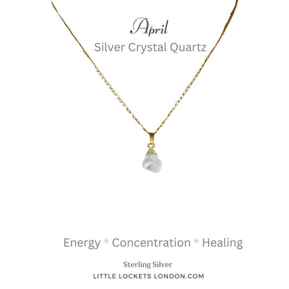 Silver crystal quartz raw gemstone with gold plated sterling silver tip suspended from a gold plated sterling silver chain. The pendant is mounted on card with the birth month and name of the gem and three of its qualities - energy concentration healing