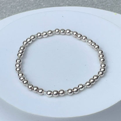 silver plated elasticated bracelet, 4mm beads and tiny silver separators. 19cm elasticated. Wear on its own or part of a stack!