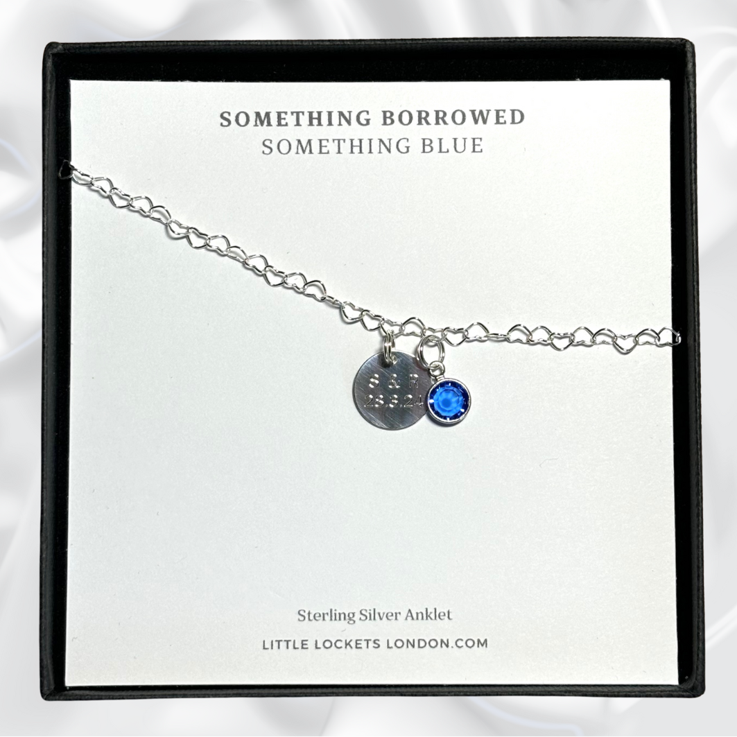 Our something blue anklet with heart shaped links and a blue crystal shown with optional personalised engraved tag and placed in gift box. 