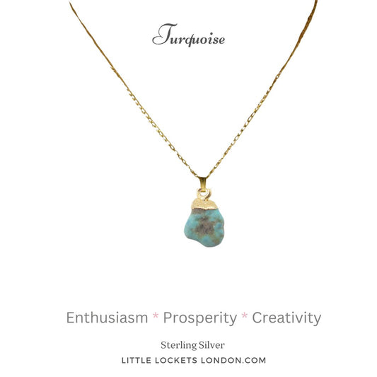 Turquoise raw crystal with sterling silver gold plated tip suspended from a gold plated sterling silver chain. The pendant is mounted on card with the gemstone's name plus three of its properties - enthusiasm, prosperity and creativity