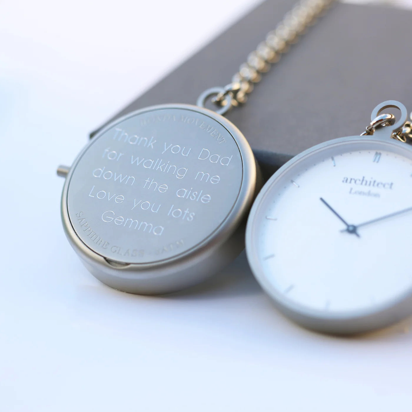 Modern pocket watch with up to five lines of engraved text. Brushed staineless steel case and 300mm chain. Shown with engraving on reverse. 