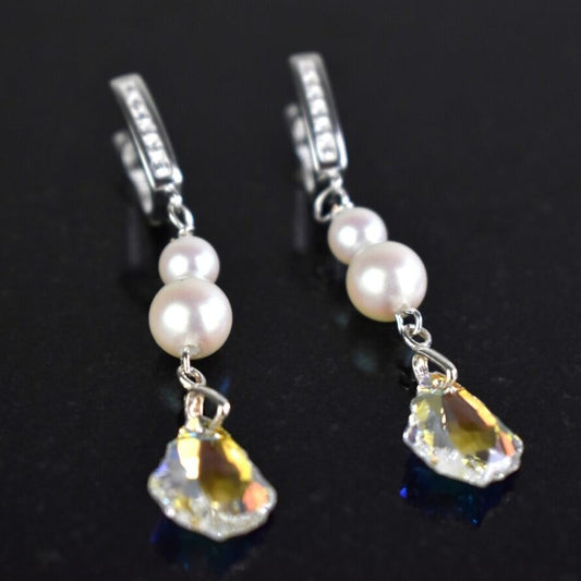 Sterling silver diamante lever back wires hold two freshwater ivory pearls and a sparkling Baroque highest quality Austrian crystal. Colour shown is crystal AB