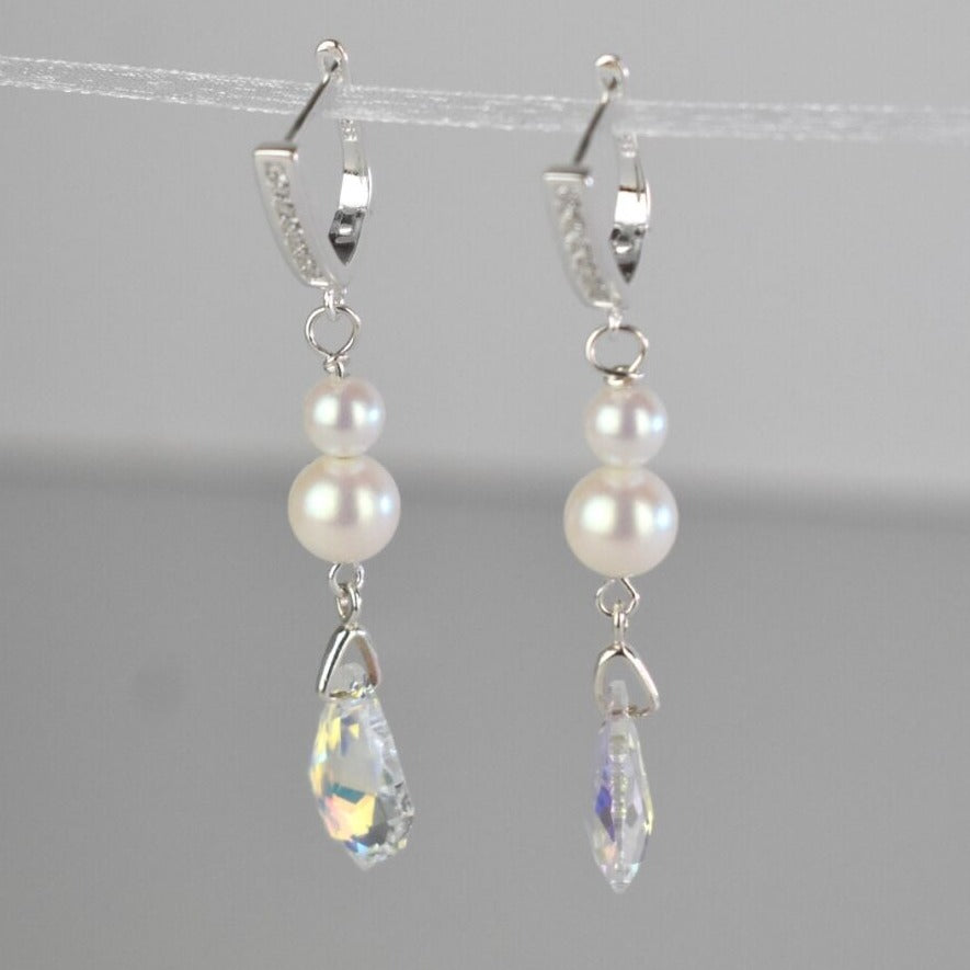 Sterling silver diamante lever back wires hold two freshwater ivory pearls and a sparkling Baroque highest quality Austrian crystal.