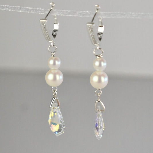 Sterling silver diamante lever back wires hold two freshwater ivory pearls and a sparkling Baroque highest quality Austrian crystal.