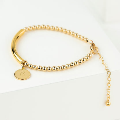Gold filled bead and bar bracelet with 18 disc showing lobster clasp and extension chain