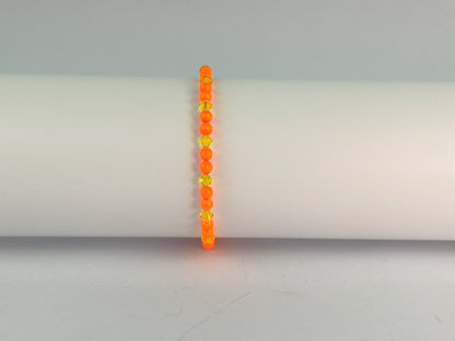 neon orange beads teamed with sunshine yellow crystals for this cute elasticated bracelet