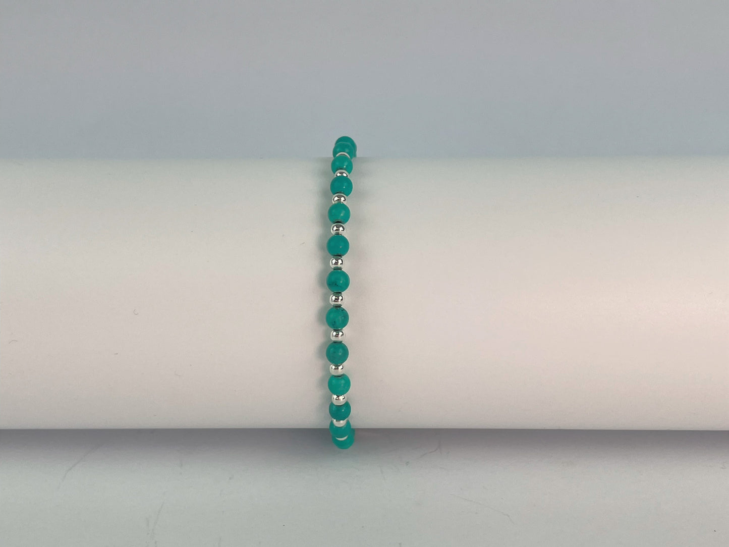 elasticated bracelet of turquoise and silver beads