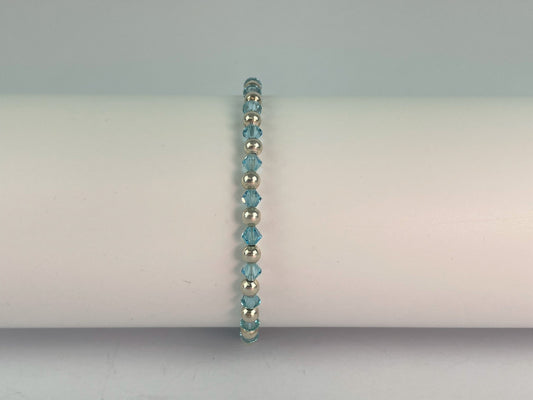 sky blue crystals and silver plated beads make up this pretty blue bracelet.