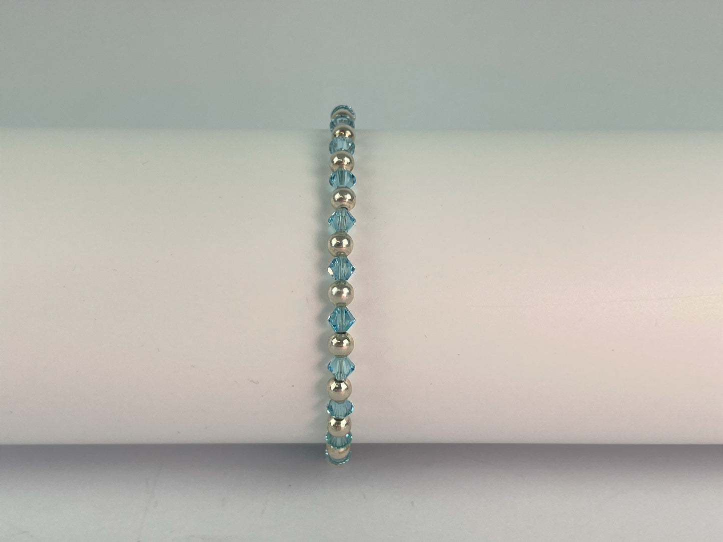 sky blue crystals and silver plated beads make up this pretty blue bracelet.