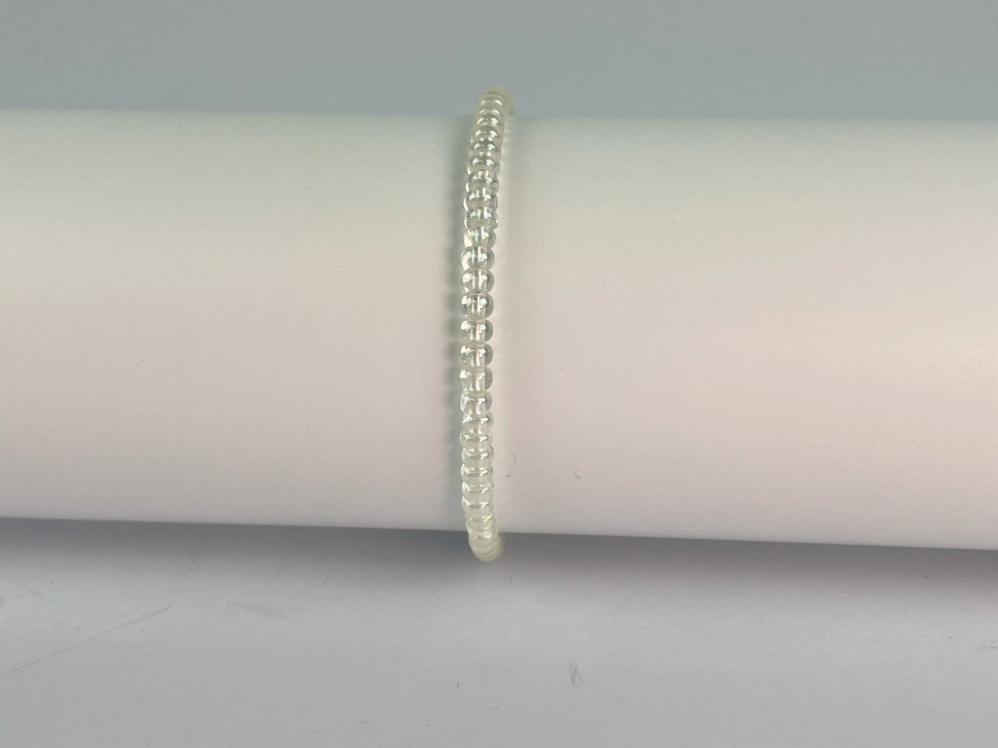 Simple glass 4mm beads form this elasticated stacking bracelet