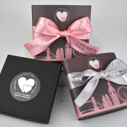 Your gift will arrive in a branded gift box or choose to upgrade your gift wrap with a London skyline wrap and pink or grey branded  hand tied ribbon