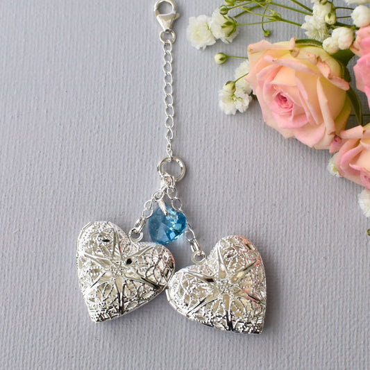 Handmade double wedding bouquet charm. Two filigree lockets are separated by blue crystal heart All the items are secured by sterling silver chain and a lobster clasp.