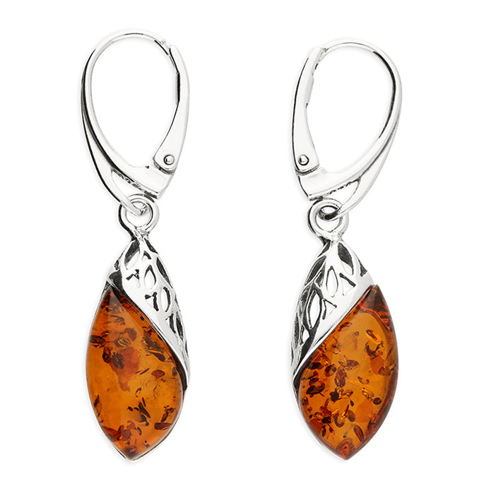 Sterling silver filigree earrings hold a cognac amber drop. Suspended from sterling silver leverback wires