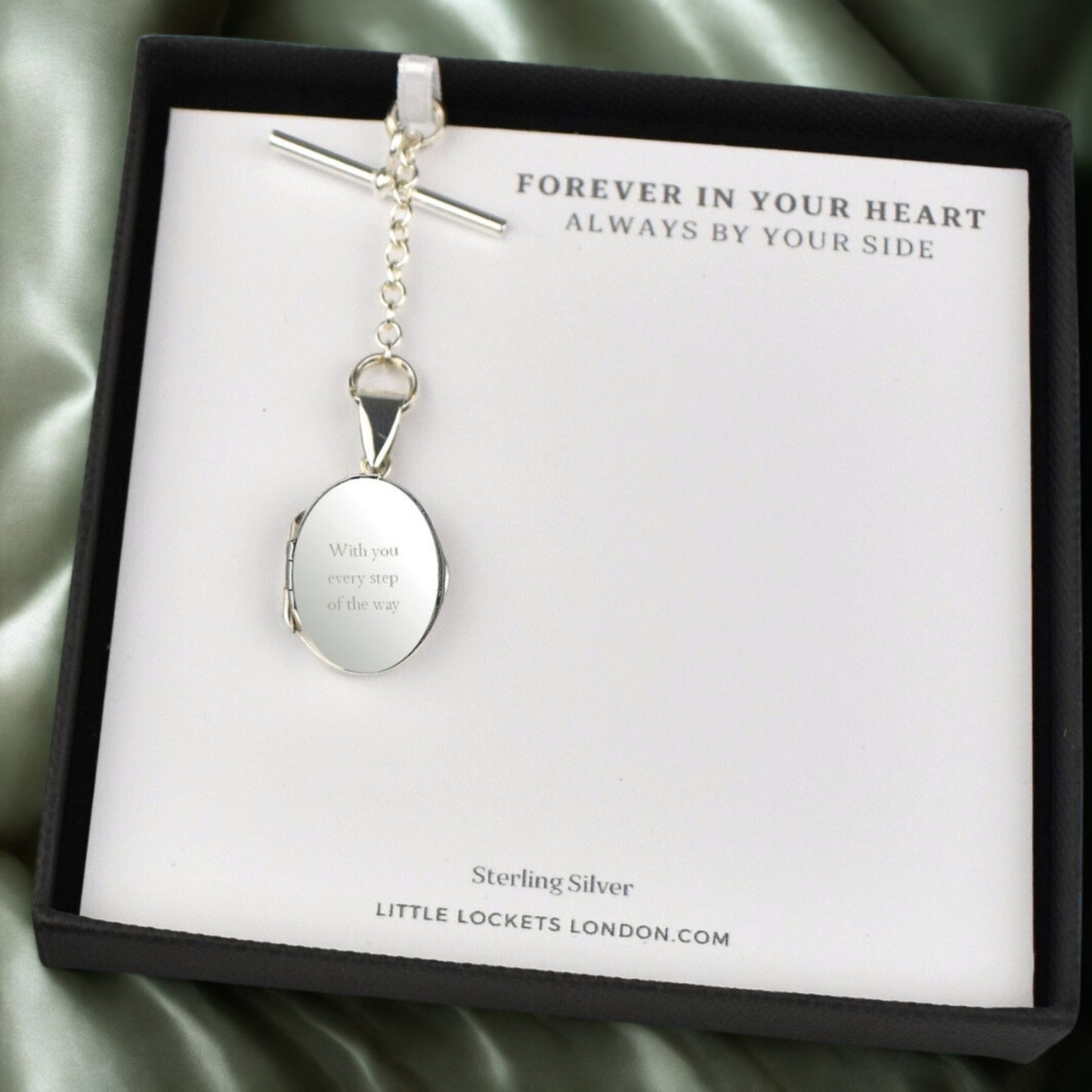 Engraved sterling silver oval photo locket on chain with t-bar fastening in gift box on message card