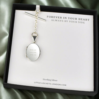 Engraved sterling silver oval photo locket on chain with t-bar fastening in gift box on message card